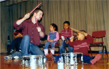 Teacher using music to support teaching social emotional skills