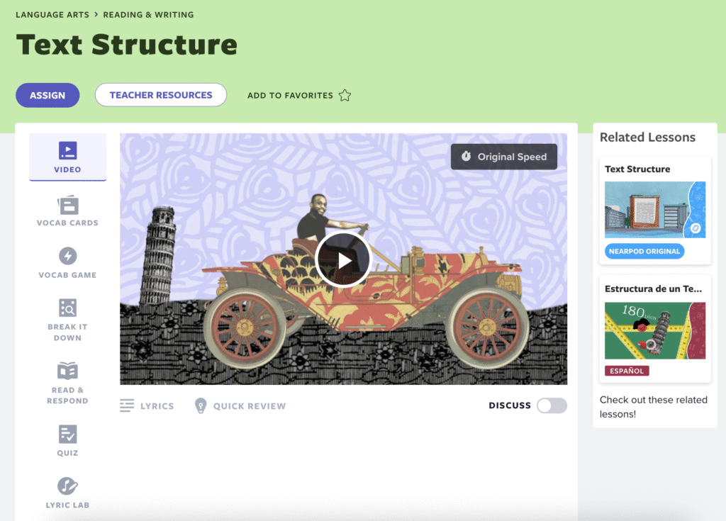 A screenshot of Flocabulary's "Text Structure" lesson in the Language Arts section. The interface shows a video player featuring an animated vintage car with the Leaning Tower of Pisa in the background. Navigation options include Video, Vocab Cards, Vocab Game, and other learning activities. Teacher controls for assignment and resources appear at the top, with related lessons displayed on the right.
